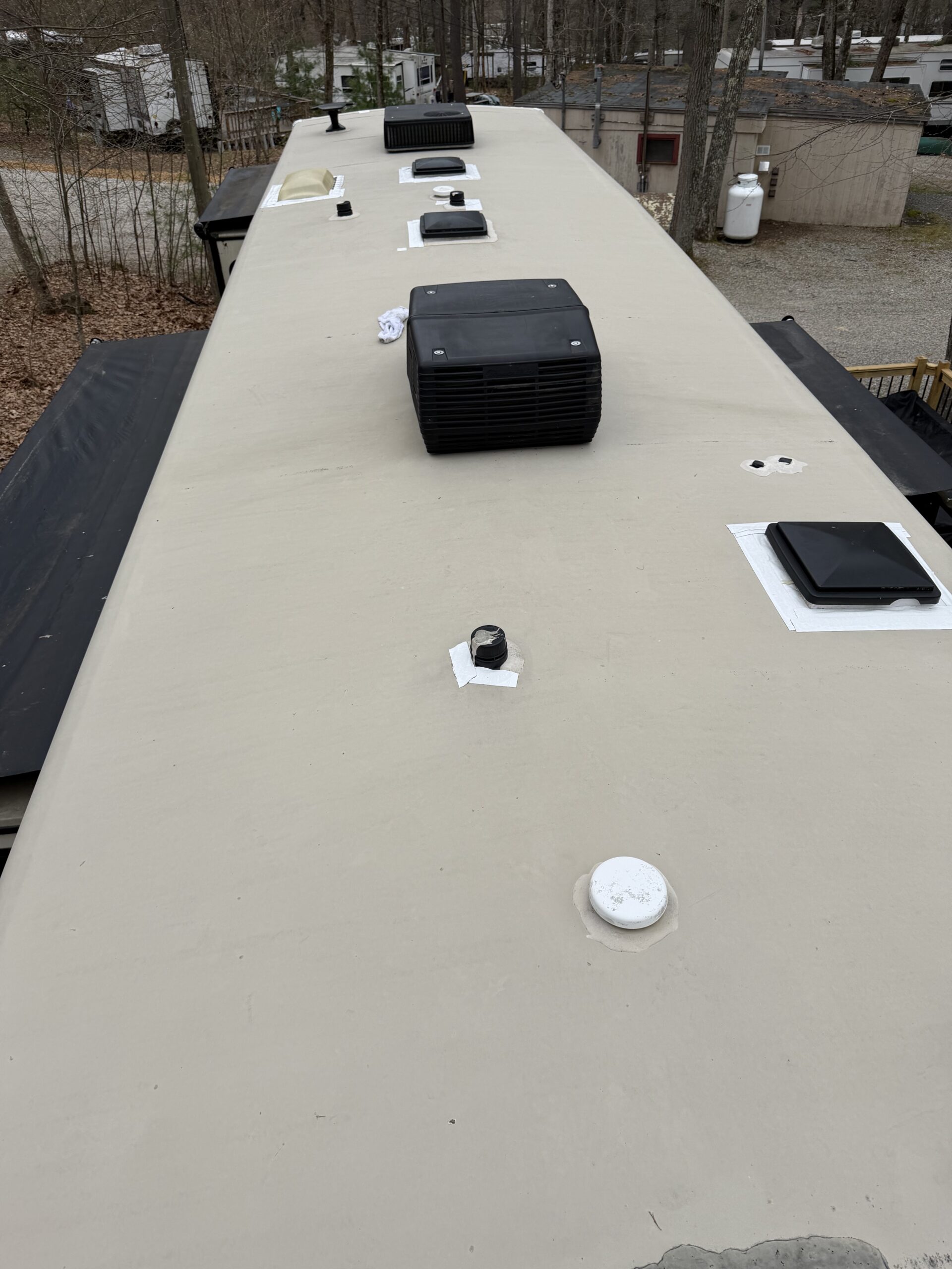 Weathered RV roof before mobile coating service